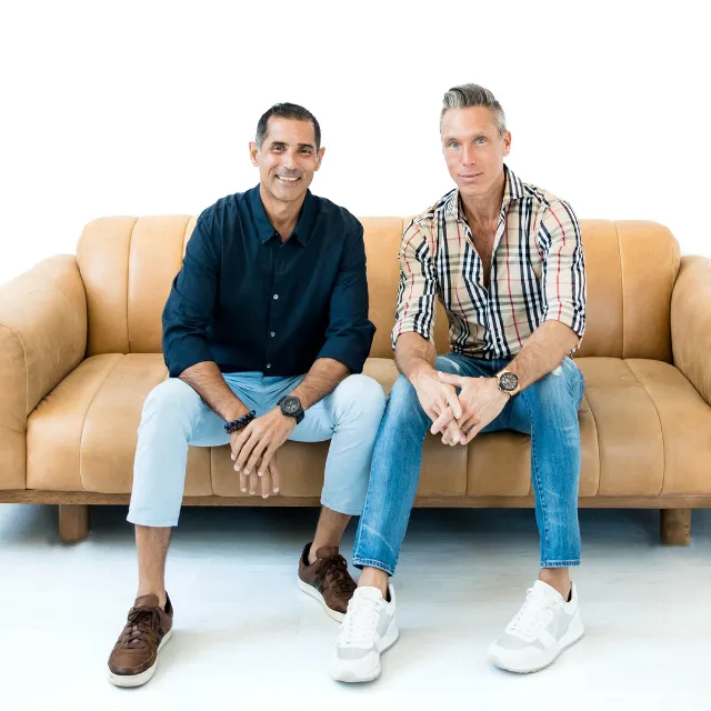 tilt shift lens photography of person lifting hand