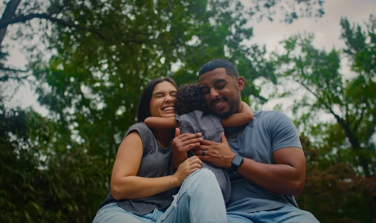 A family hug outdoors