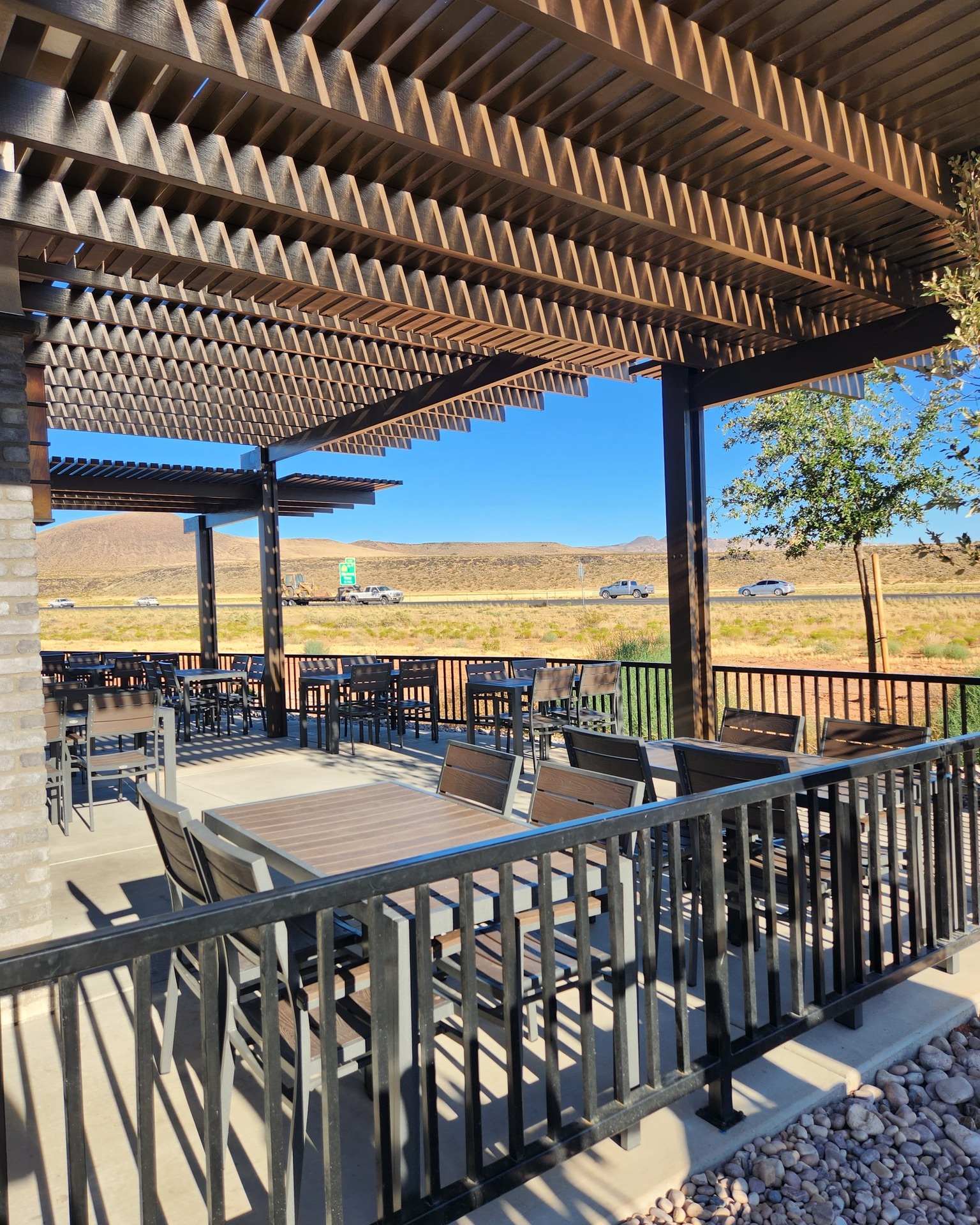 Heavy-duty commercial shade structure over outdoor dining area