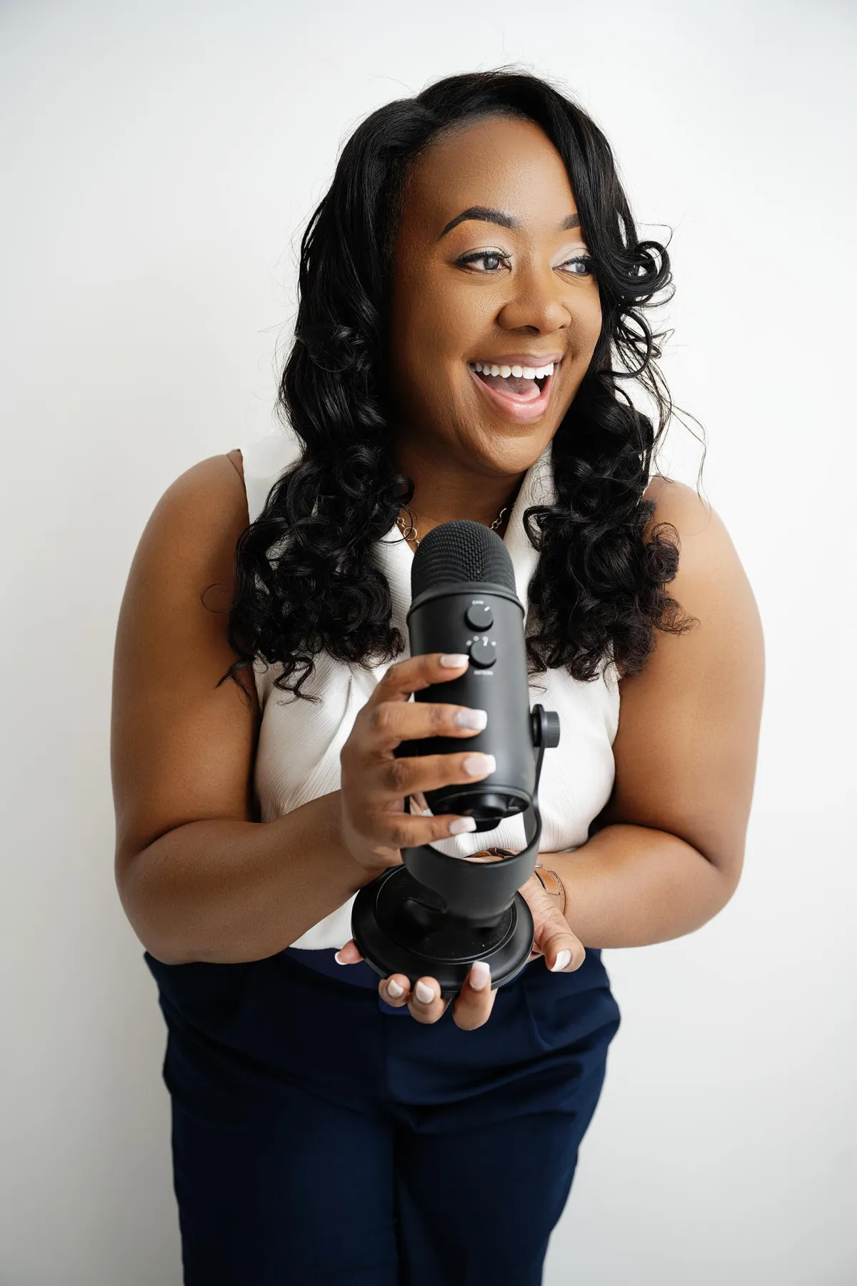 Branding photoshoot for a business owner, styled for a modern, professional look with an authentic smile.