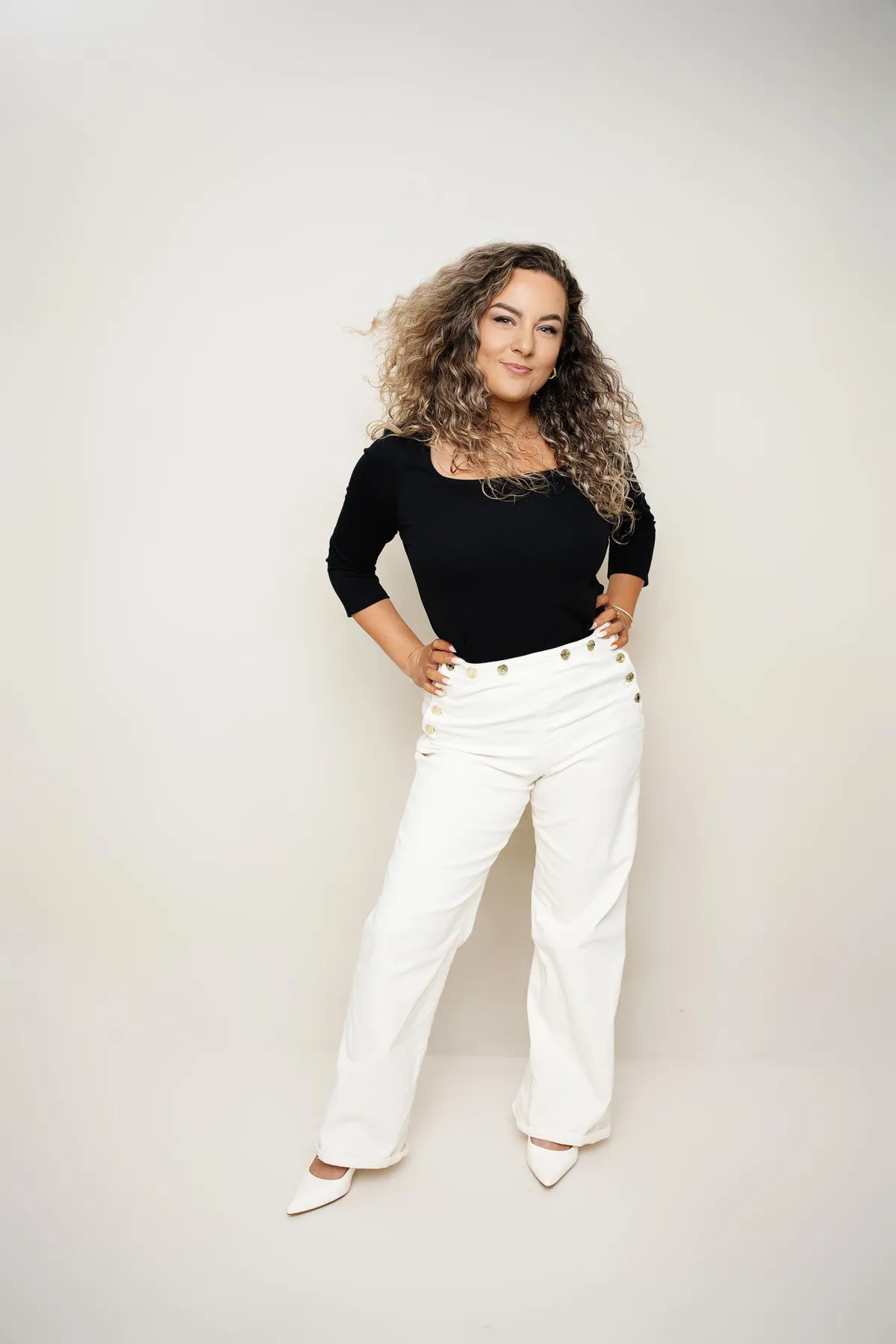 Entrepreneur showcasing her personal brand with a confident, authentic portrait