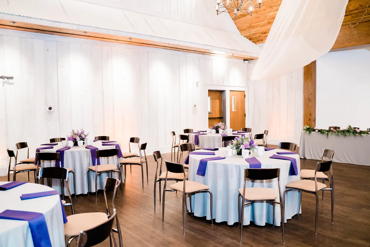 Wedding reception tables set in the ballroom at The Silo Event Center in Tulsa, Oklahoma, illustrating wedding guest count and budget decisions