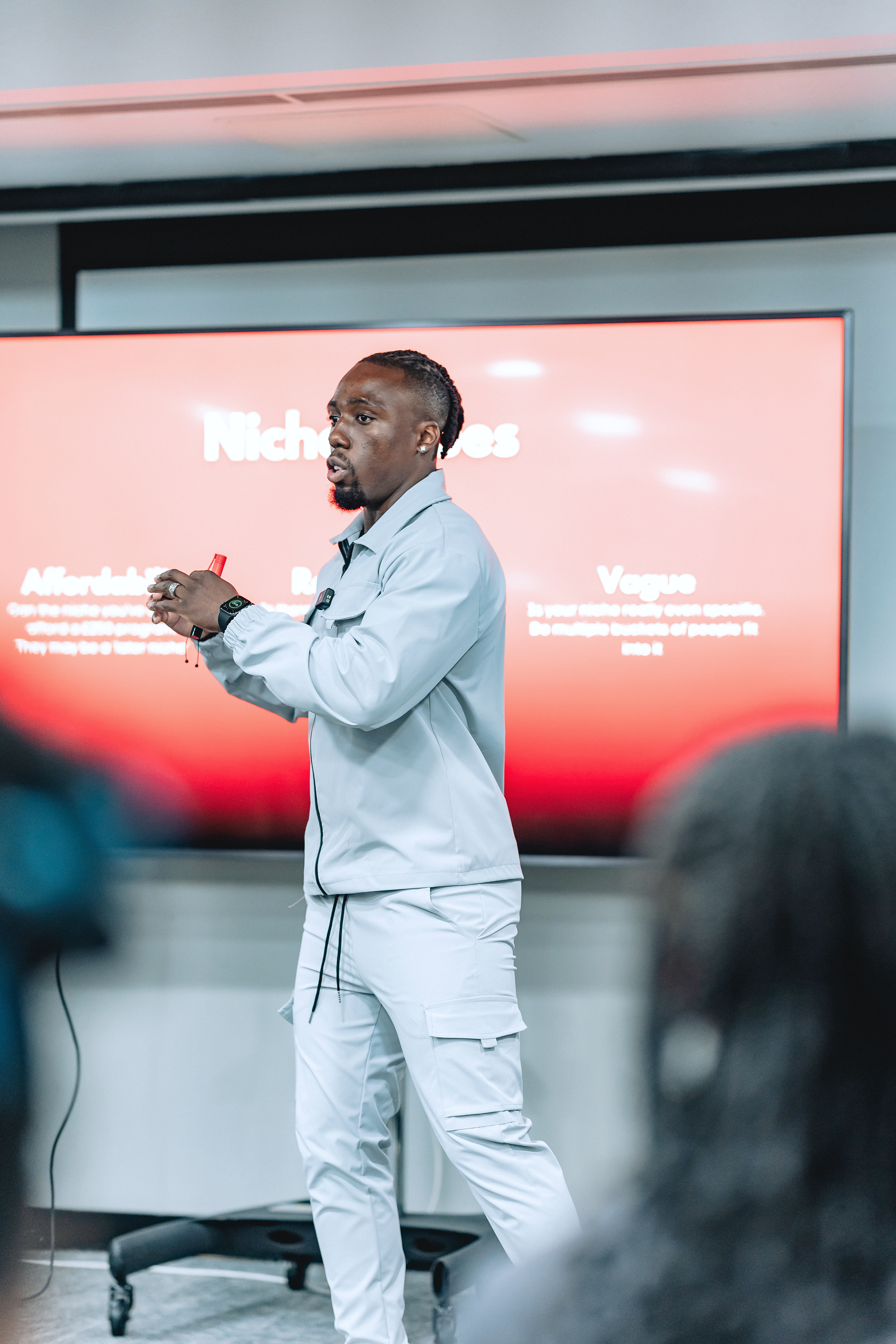 Professional black-and-white headshot of Michael Akinfisoye, corporate portrait.