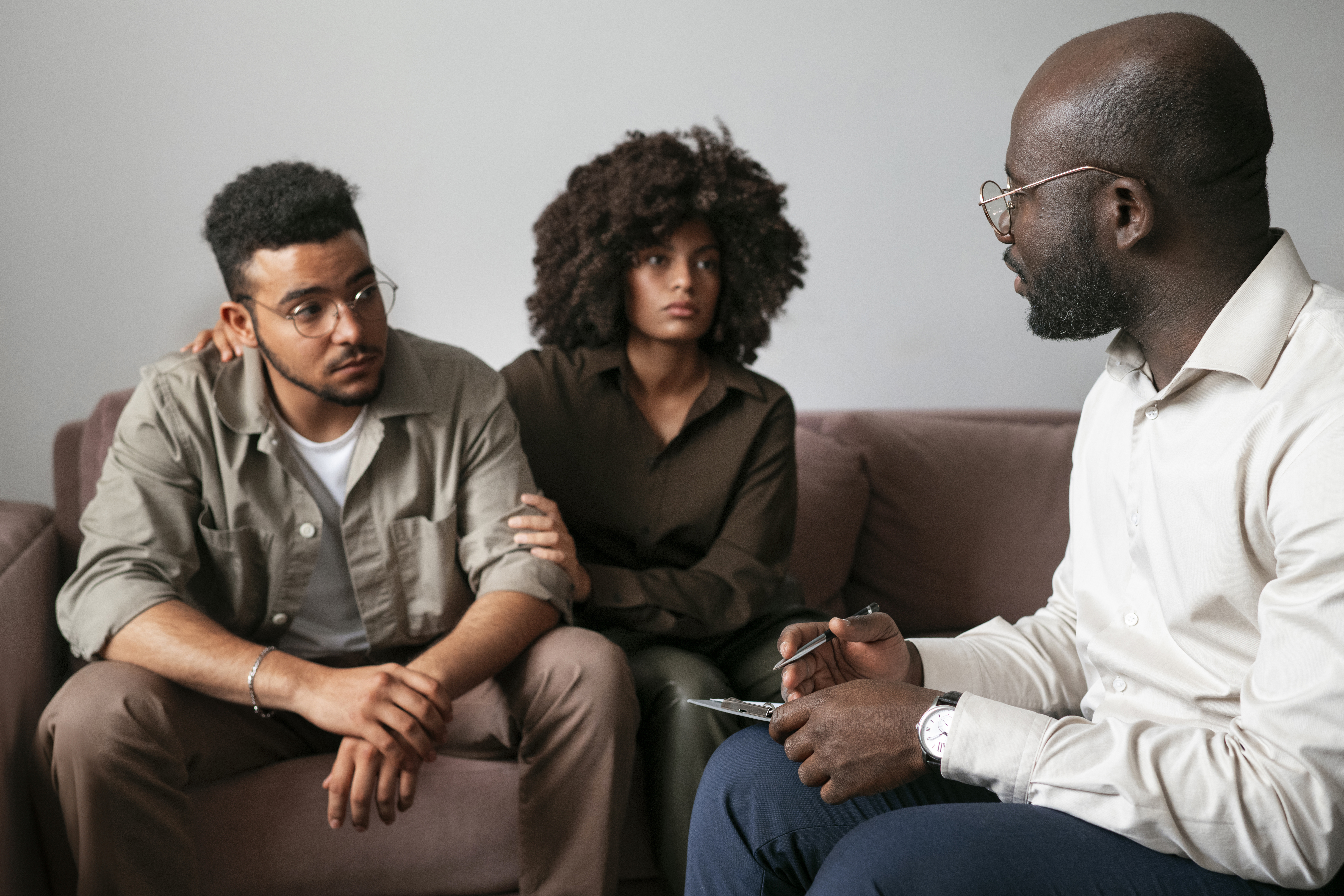 a tree on the side of a dirt road