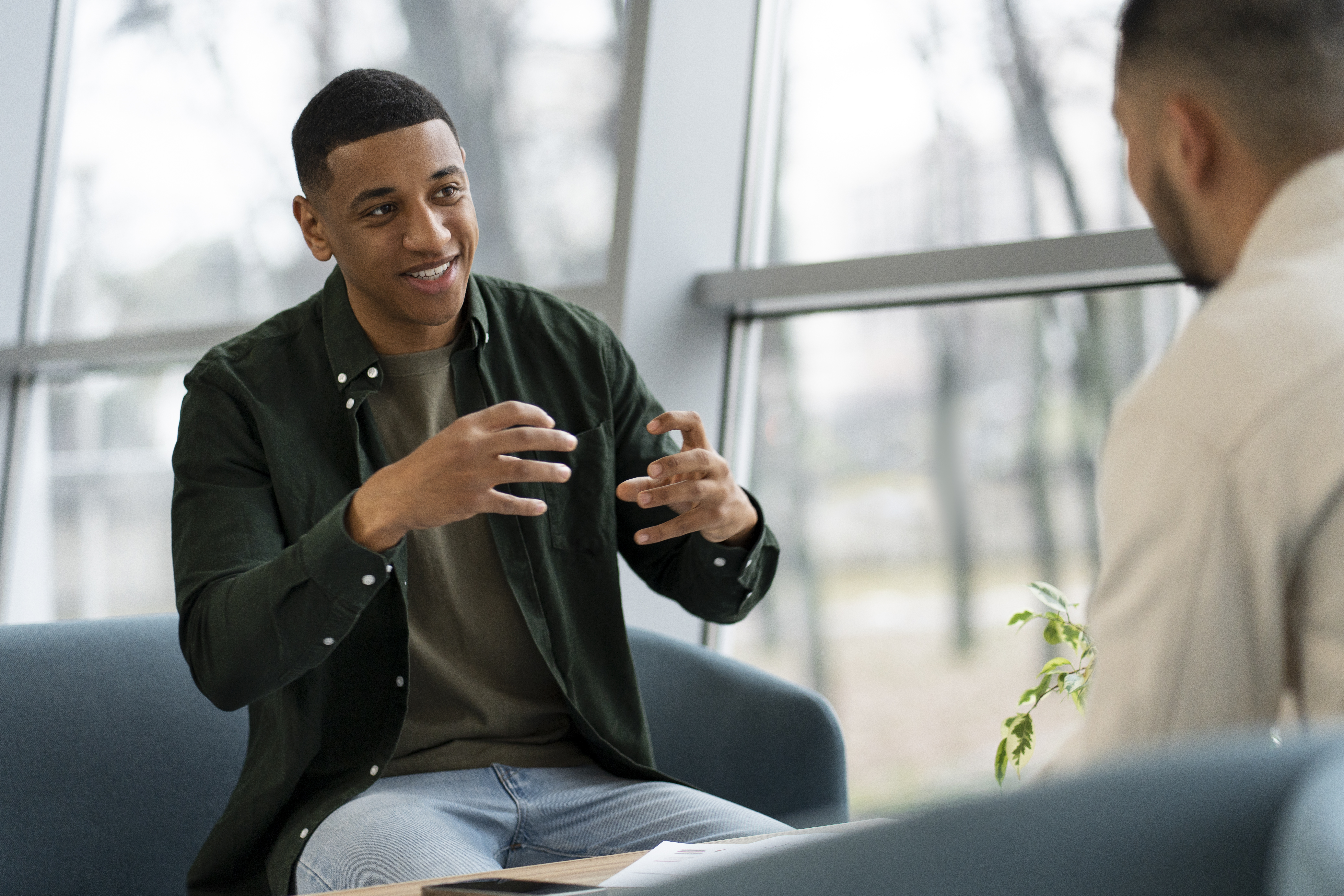 a tree on the side of a dirt road