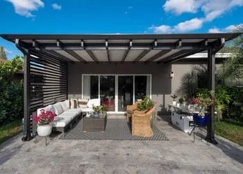 Modern outdoor patio with black pergola and outdoor furniture in Albuquerque