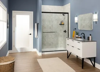 Modern bathroom remodel with glass shower enclosure and floating vanity in Albuquerque