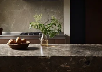 Polished marble countertop with hydrophobic surface protection in modern kitchen