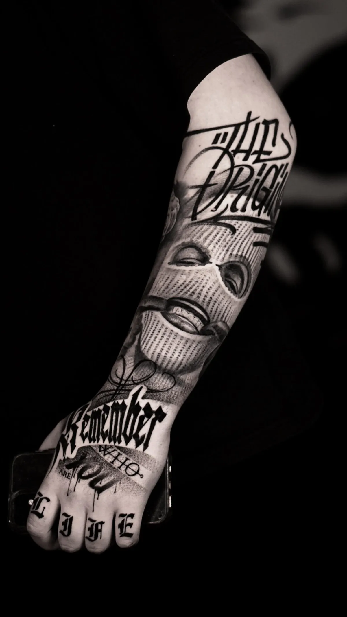 person with tattoo on right arm