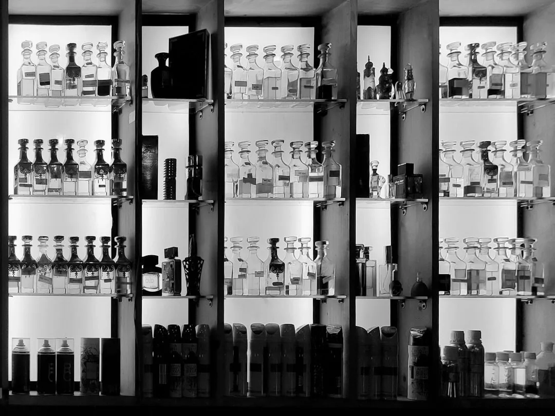 a shelf filled with lots of bottles of liquor