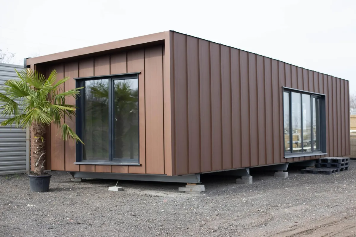 A white toilet sitting next to a walk in shower