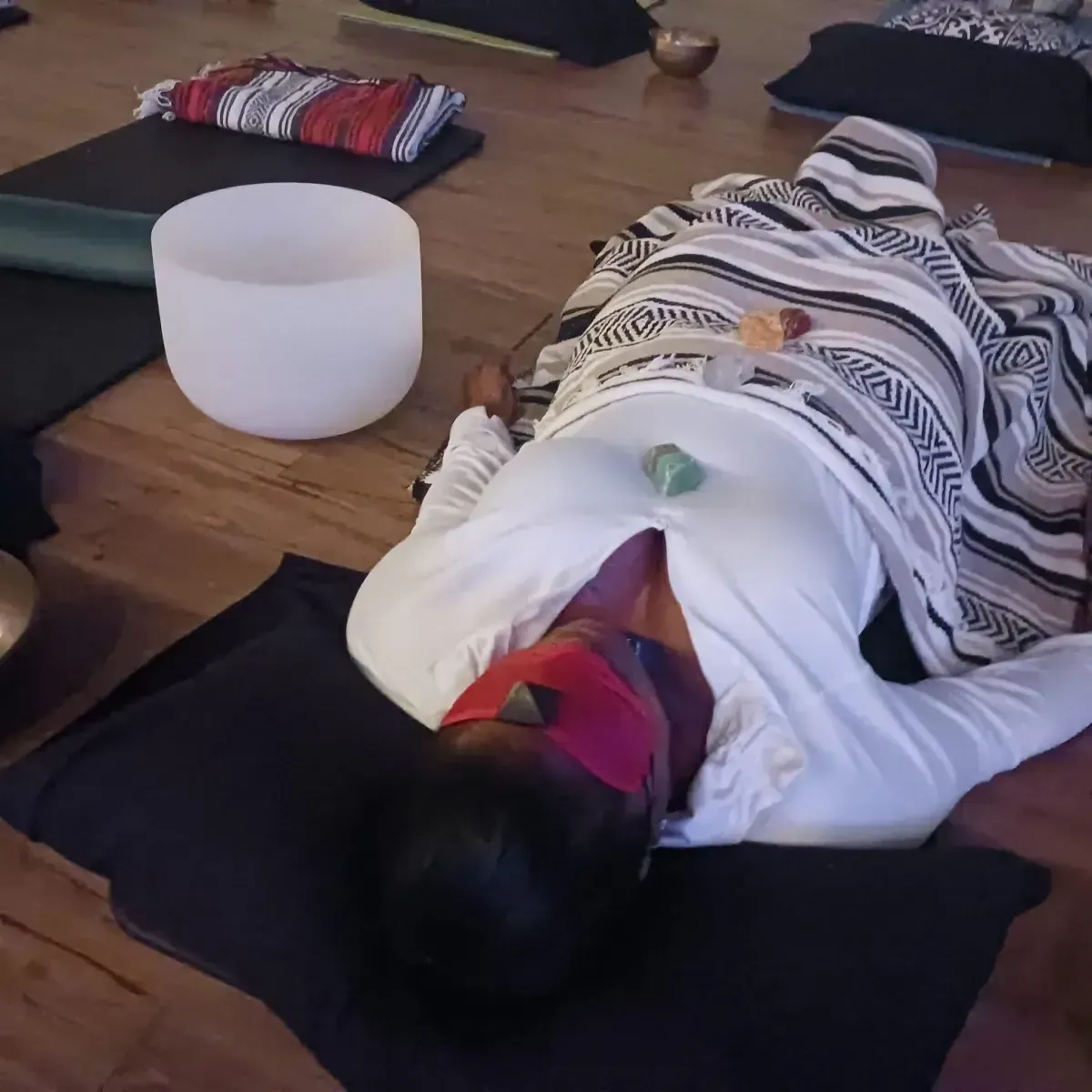 A person engaging in Reiki healing techniques in a calm setting.