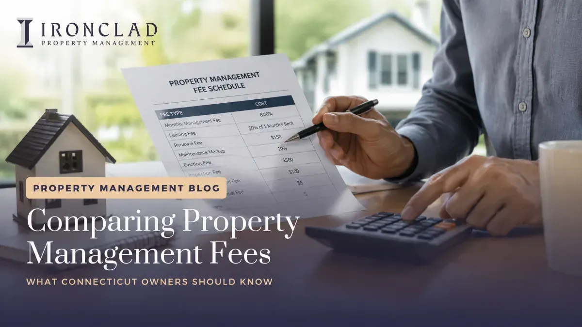 A person reviewing a detailed property management fee schedule document with a pen and calculator, next to a miniature house model. The document lists various fee types and costs, highlighting the comparison of property management fees for Connecticut owners.