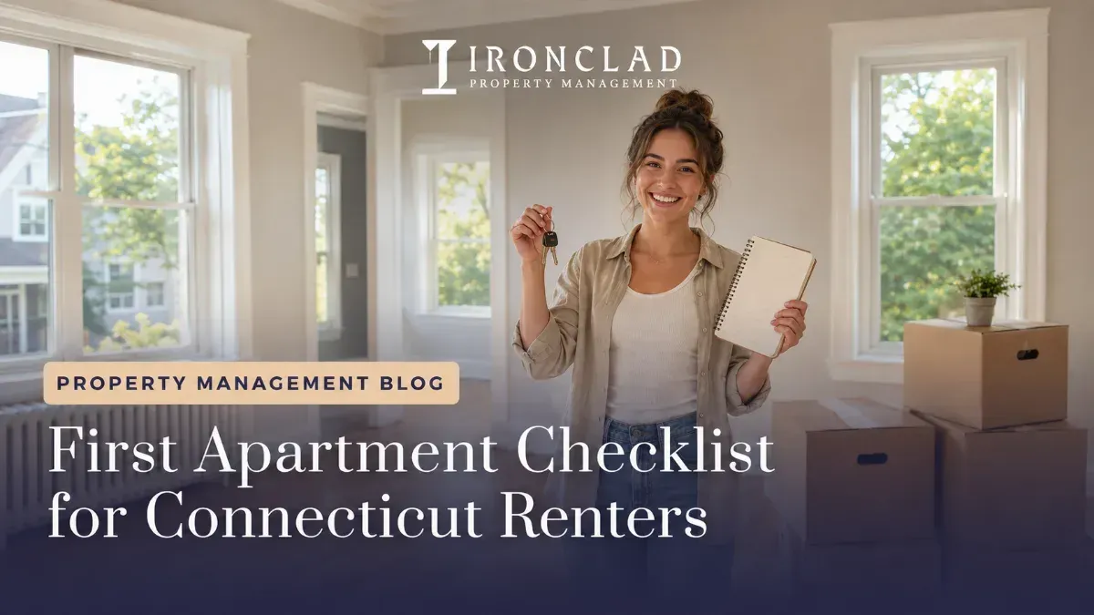 Smiling woman holding apartment keys and a checklist notebook in her new, empty apartment, with moving boxes nearby, representing a new renter's experience.