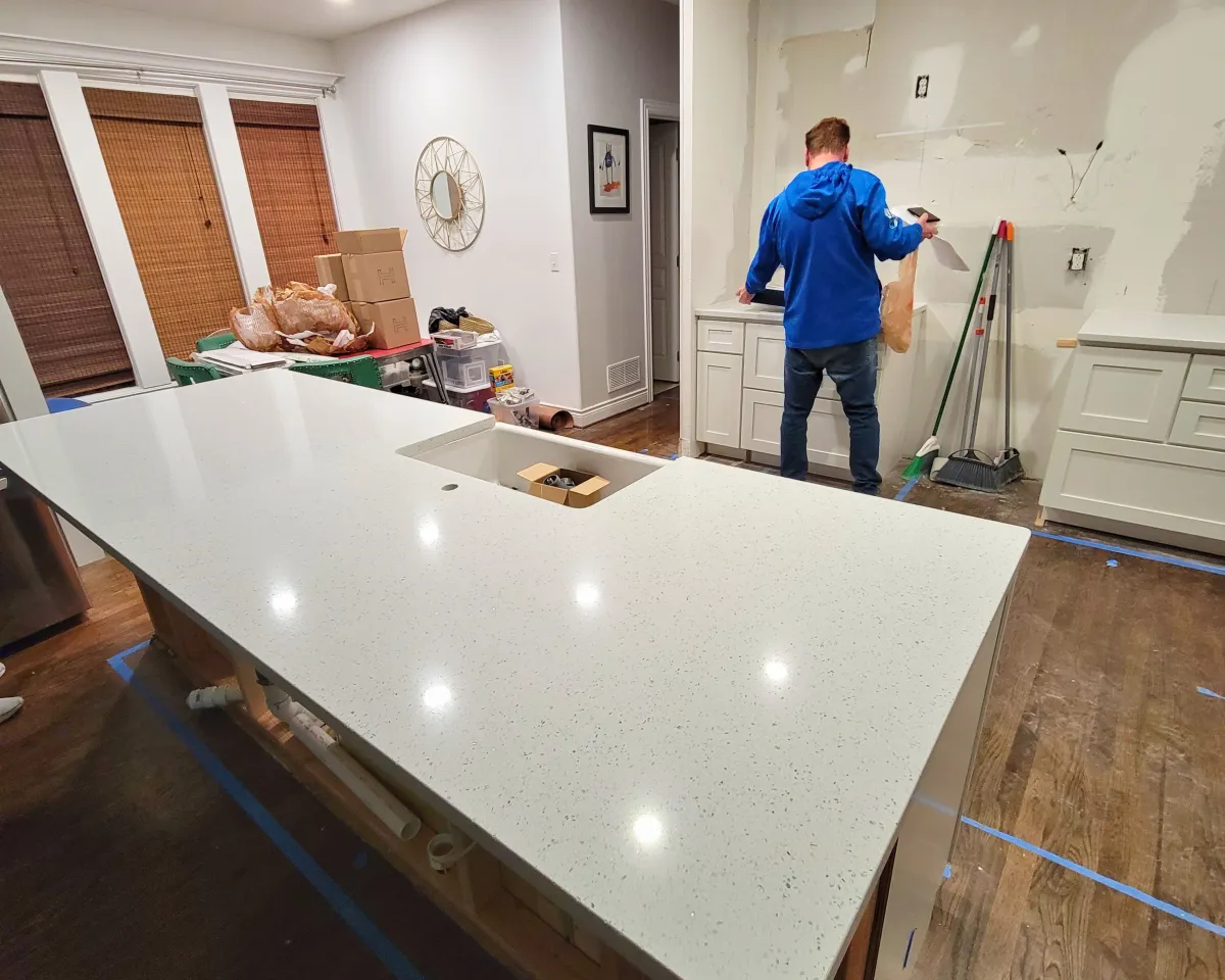 a kitchen with a center island with stools
