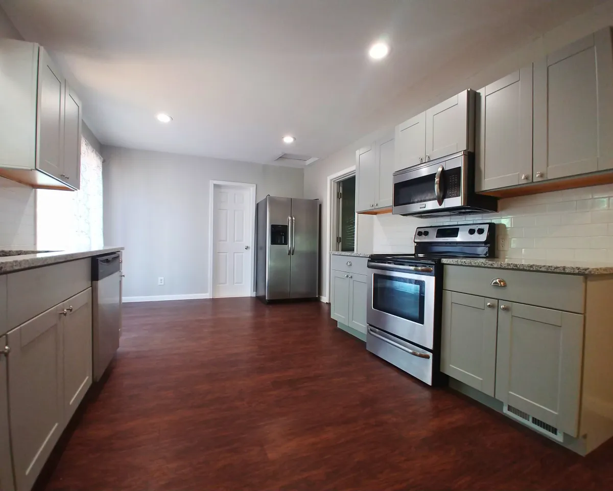 a kitchen with a center island with stools