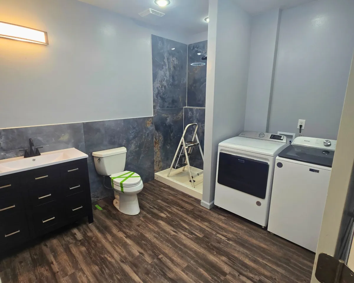 a kitchen with a center island with stools
