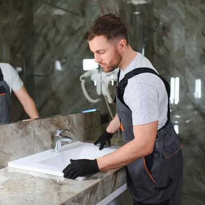 Plumber working on bathroom remodel in pensacola home