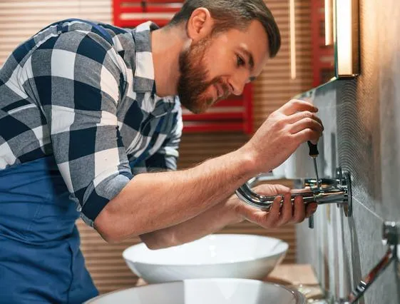 Pensacola plumber fixing faucet