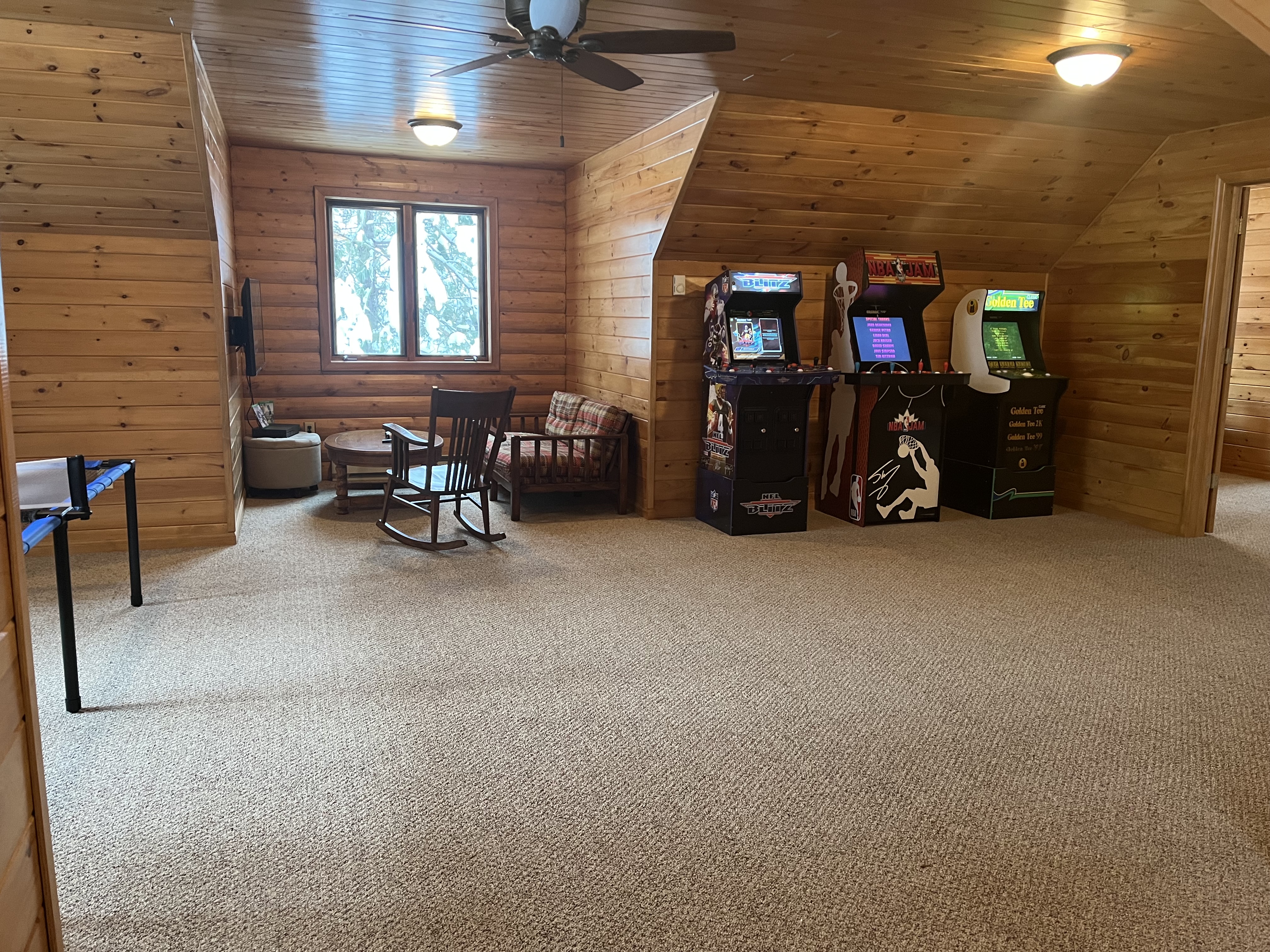 Game room with pack and play and a bunk bed