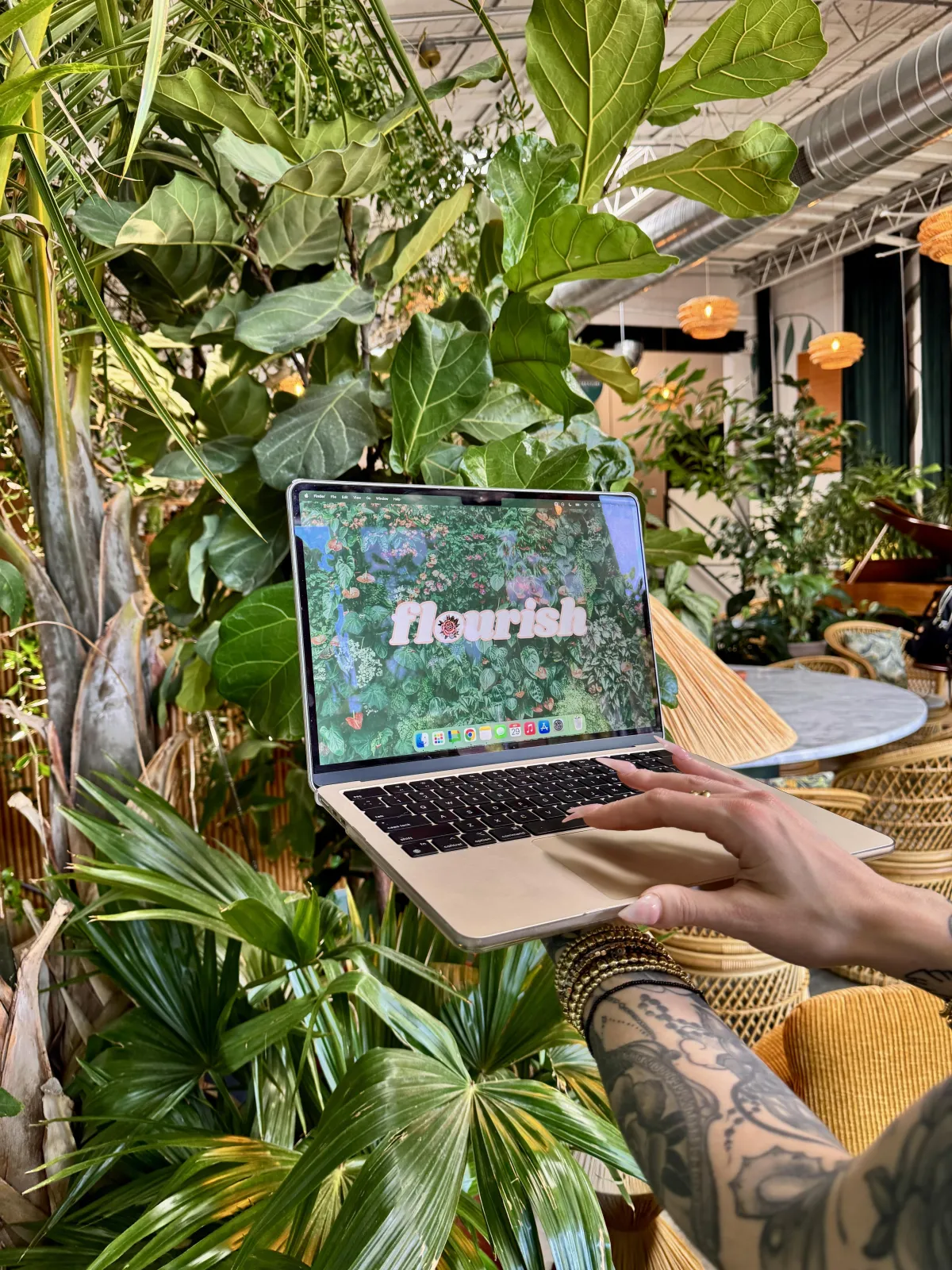 Laptop with Flourish branding representing CRM and business tools for creatives