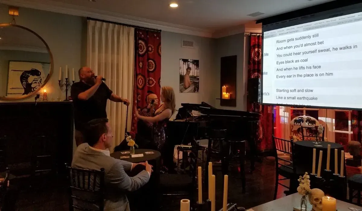 Jeremy Weinglass accompanying singers for piano bar experience at 50th birthday party 