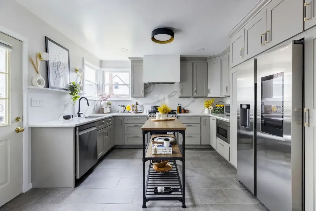 Freehold Kitchen & Bath Remodel team designing an open-concept kitchen with elegant lighting and island seating
