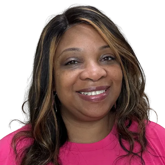 woman with long hair, smiling with a pink top