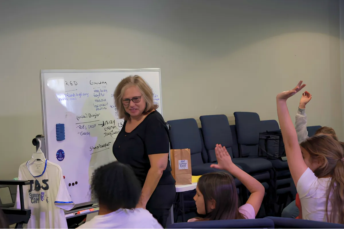 Students participating in creative arts activities, acting, filmmaking, and collaborative projects during summer camp at JDS Creative Academy.