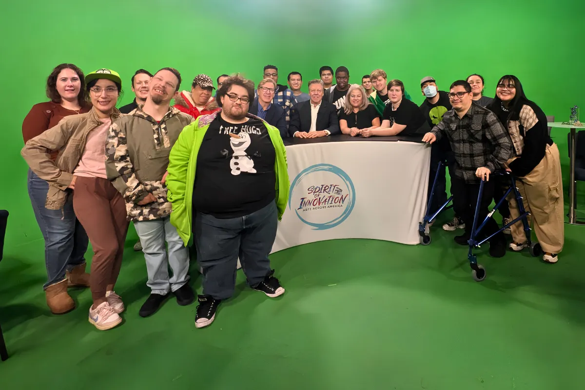 A diverse group of actors, filmmakers, and creatives collaborating in an inclusive production environment where individuals of all abilities work together.