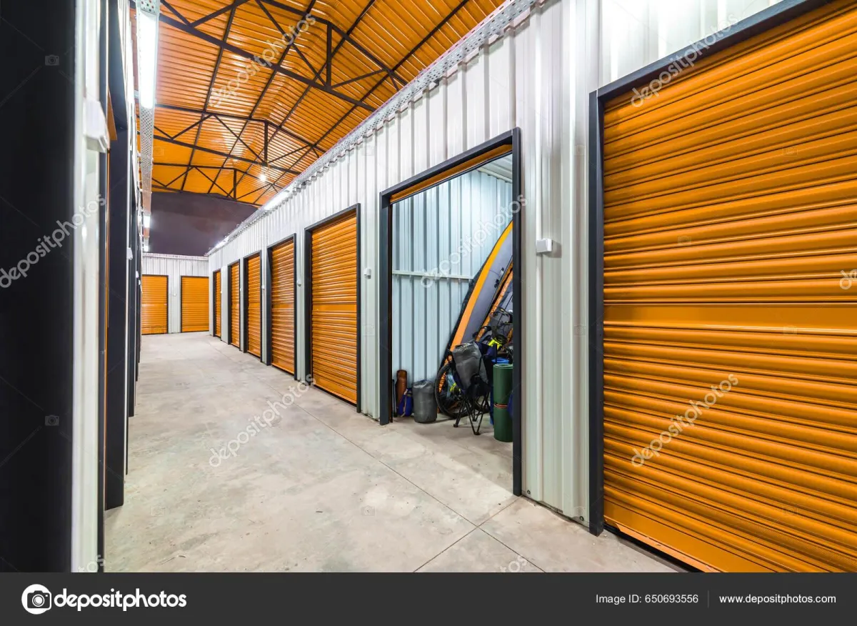 white wind turbines on green grass field under blue sky during daytime