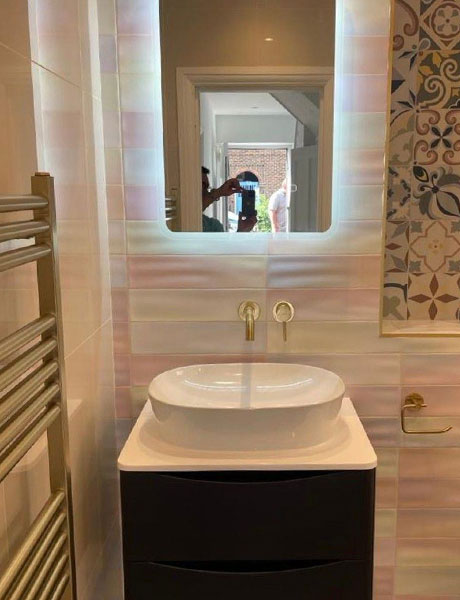 Refurbished bathroom by DR Construction, view of sink and tiling
