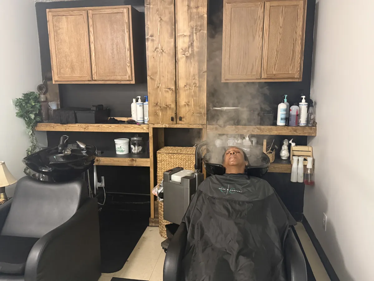 Modern neutral skincare bottle on stone