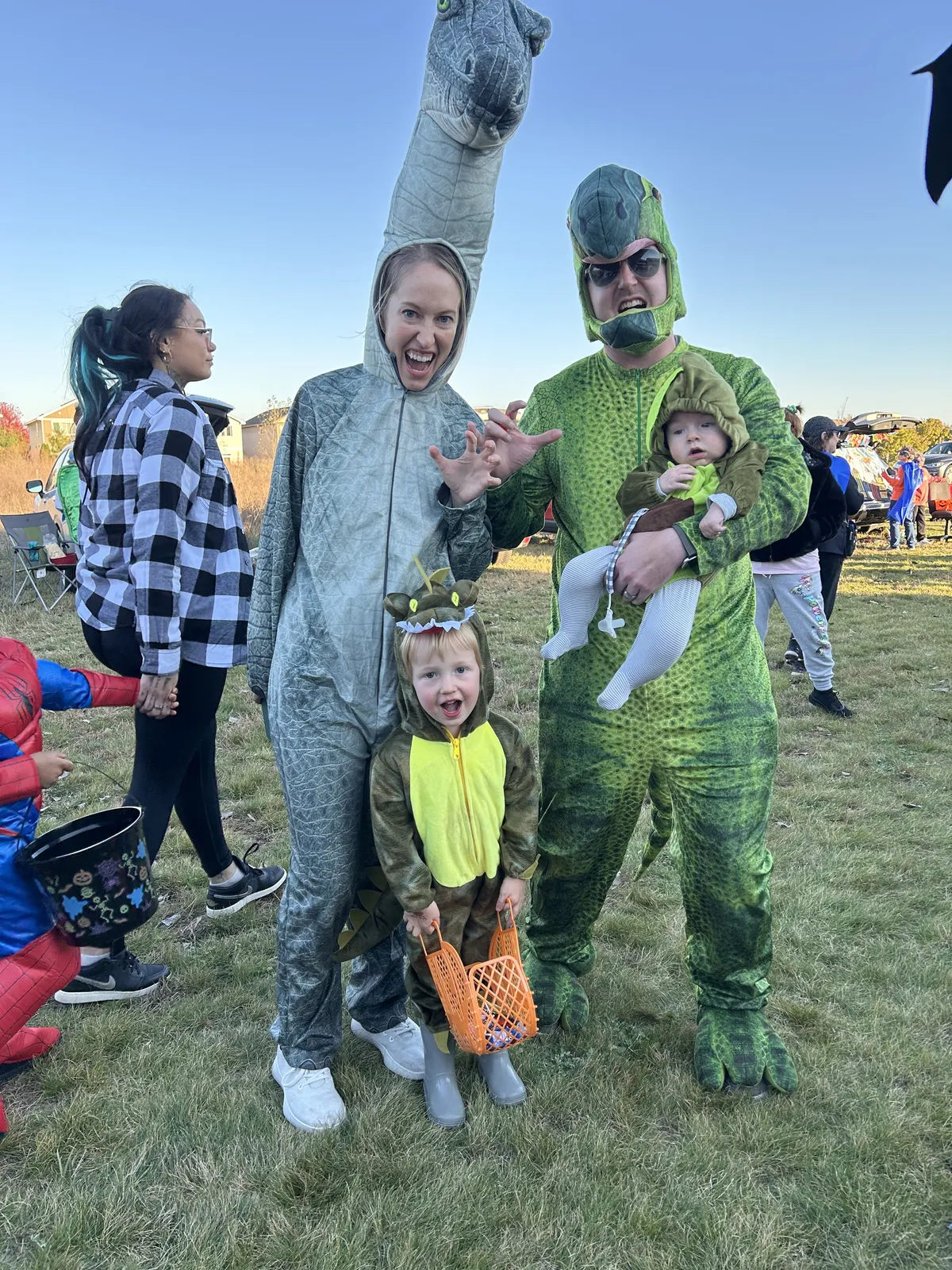 Family dressed as dinosaurs at Trunk or Treat at Chain of Lakes Church in Blaine, MN