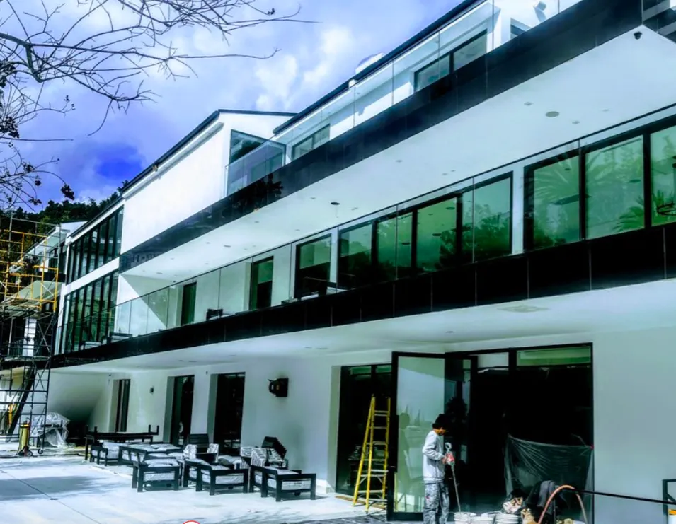 Clean And Clear Window Washing servicing a modern residential home with professional post construction cleaning crew in Los Angeles CA