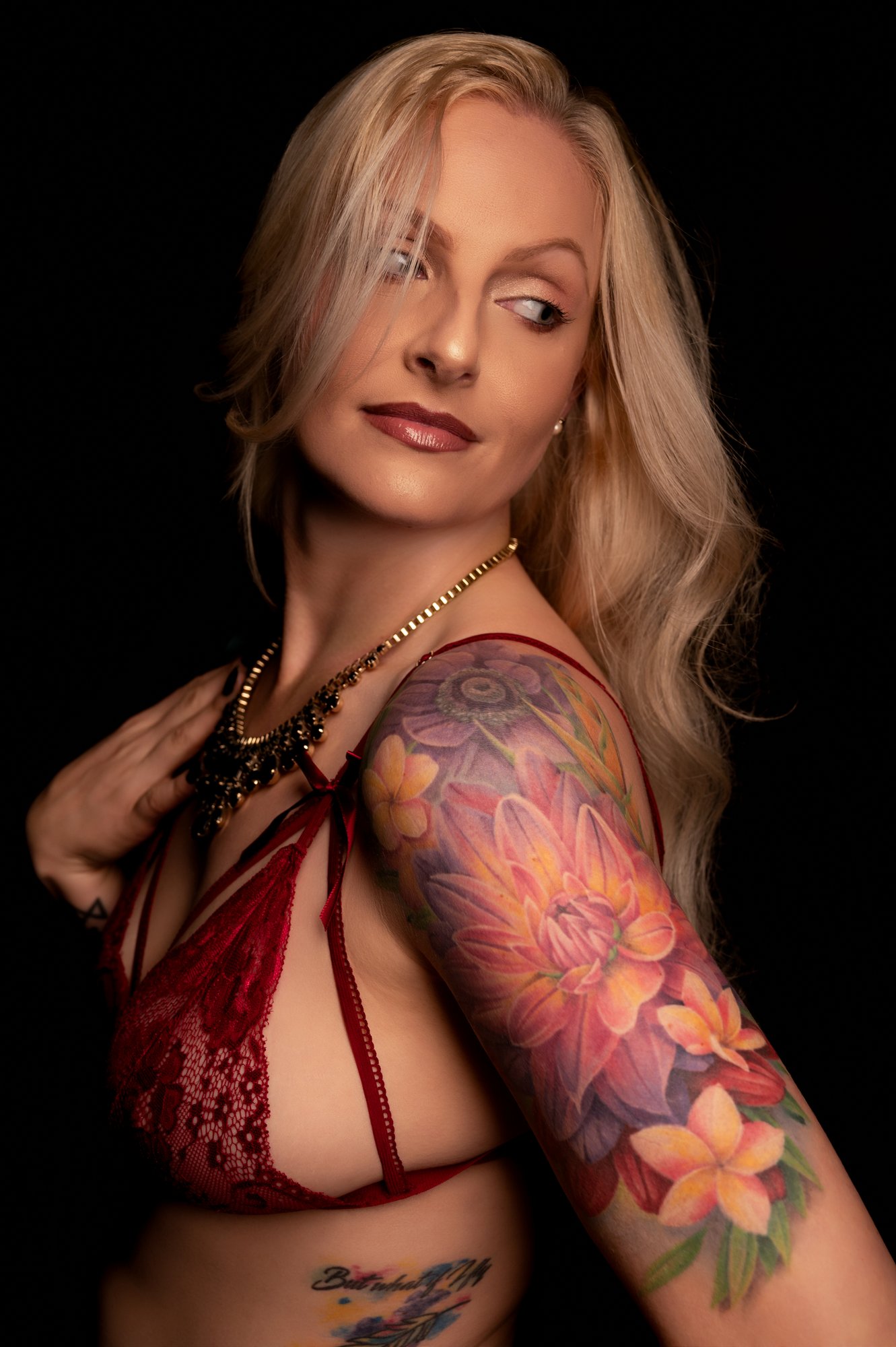 Elegant boudoir portrait with timeless composition and beautiful tattoos