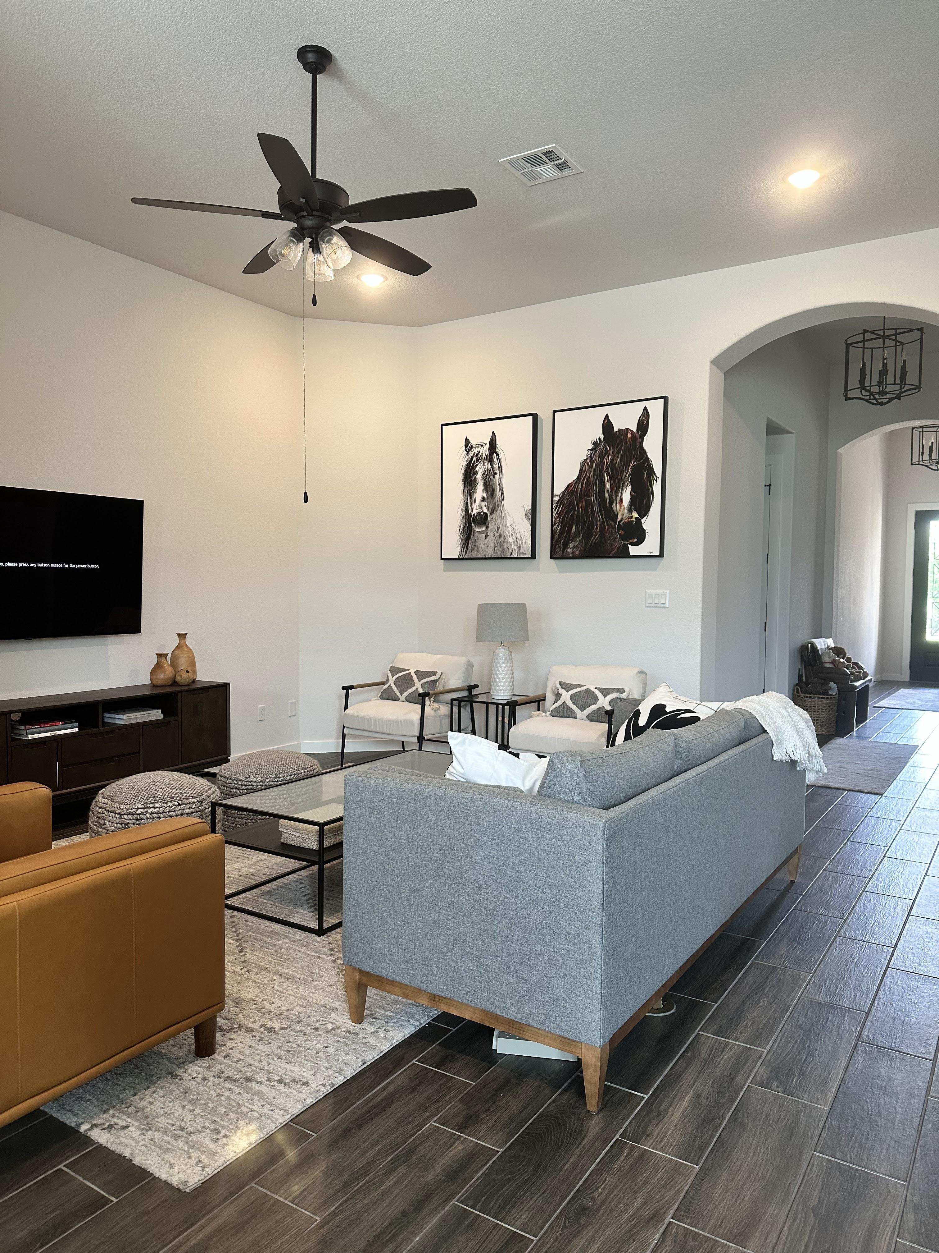 Framed artwork properly hung above a sofa in a Boise area home