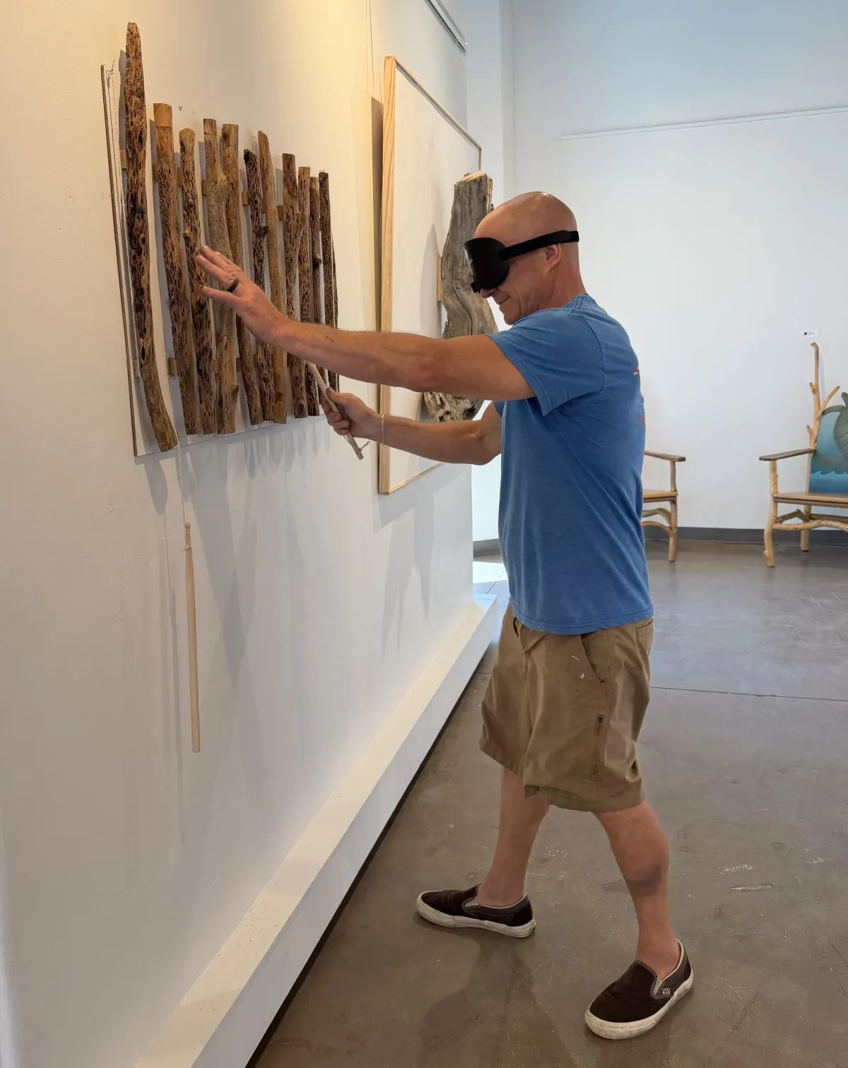 Leo Bratenas explores an interactive artwork while blindfolded, using touch and sound to experience art beyond sight.