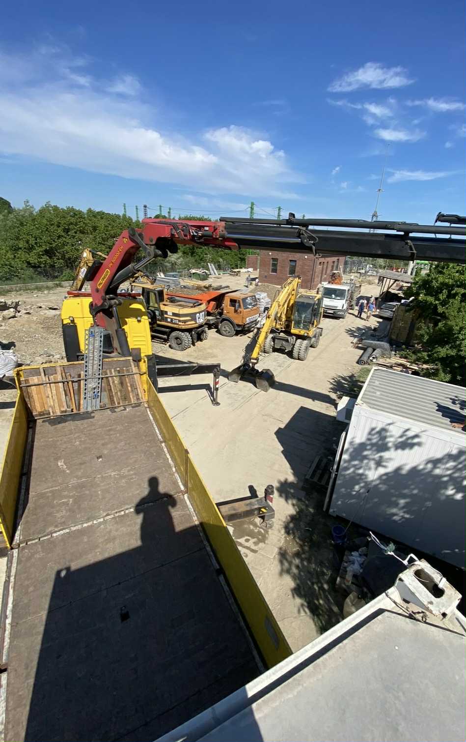 A glass ceiling encloses a lush, green garden.