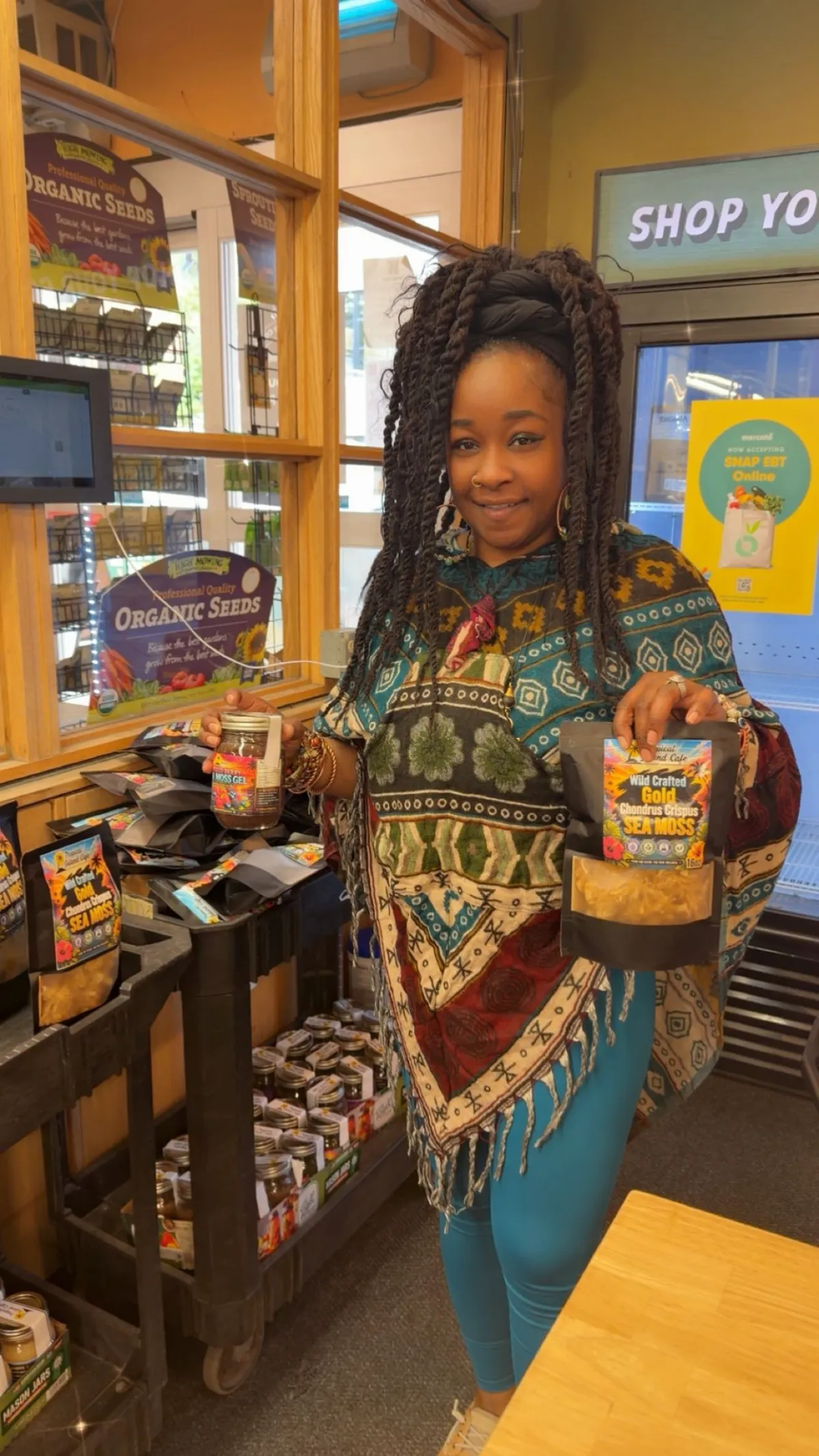 Vernesa Hines holding a jar of sea moss and dry irish sea moss