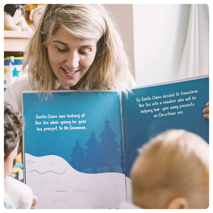 teacher reading book to children at bluegrass academy