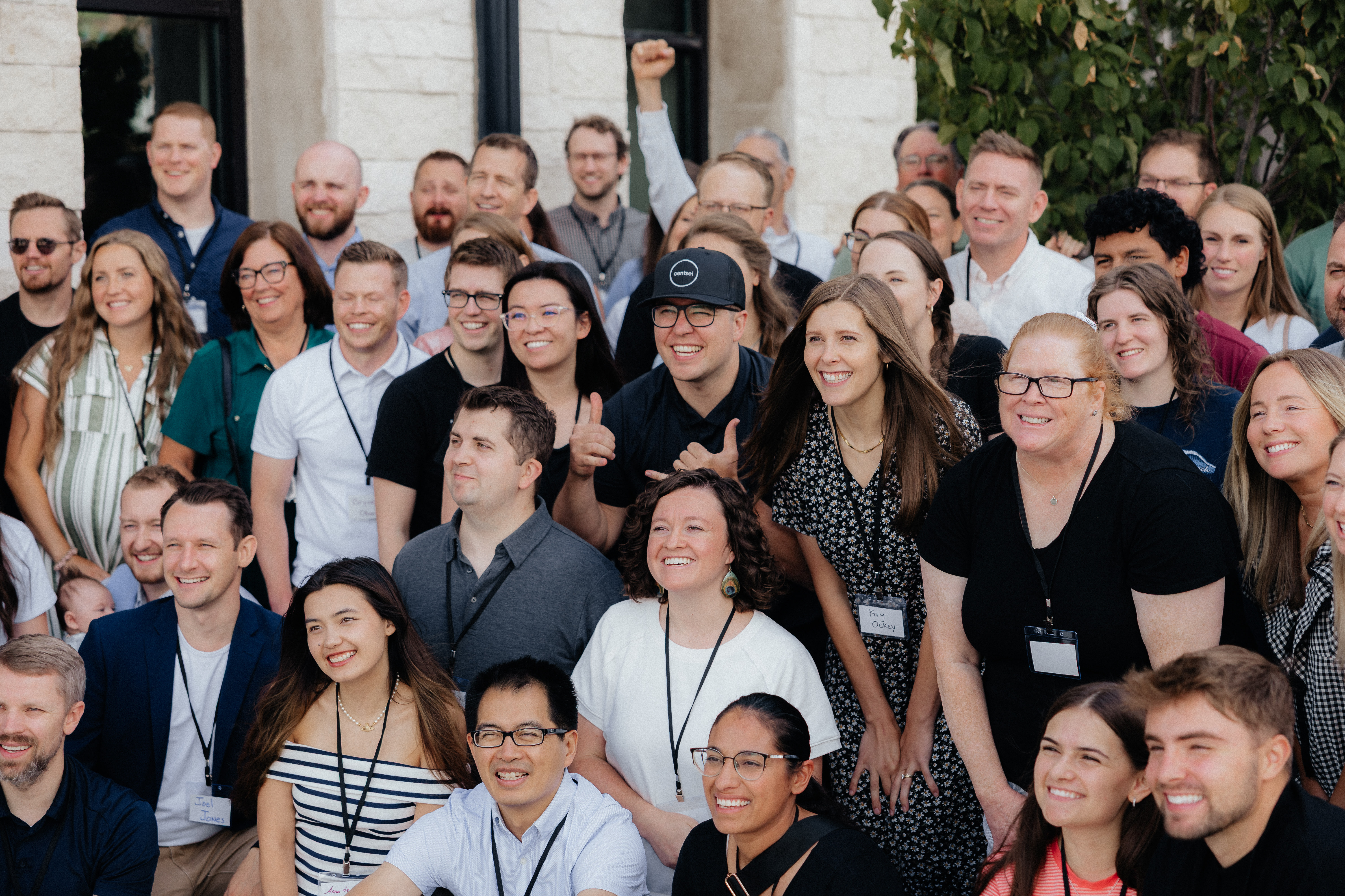 Professional portrait of Centsei Financial Coach in dark studio setting with warm gold rim lighting