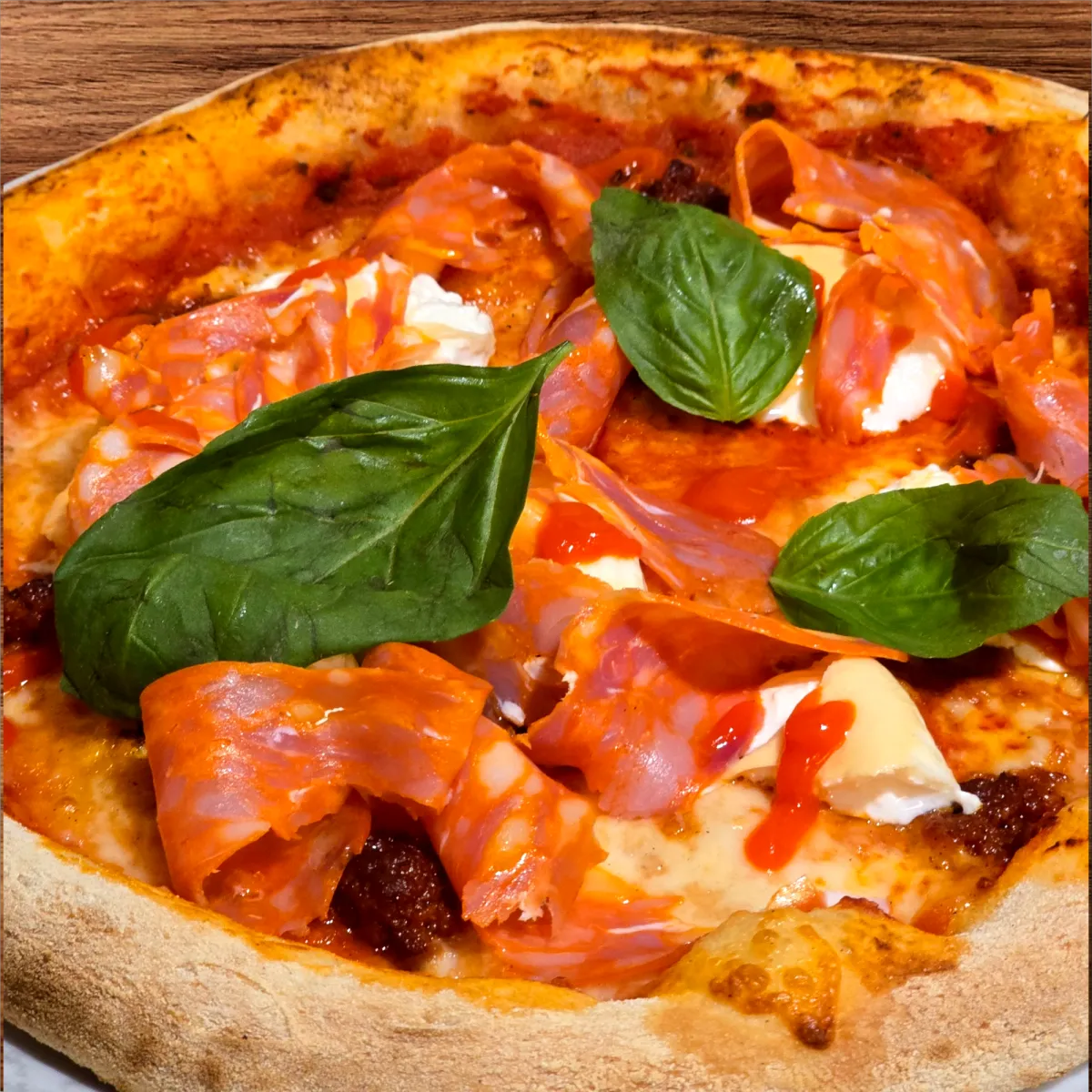 several sliced of vegetable pizza on round white platter