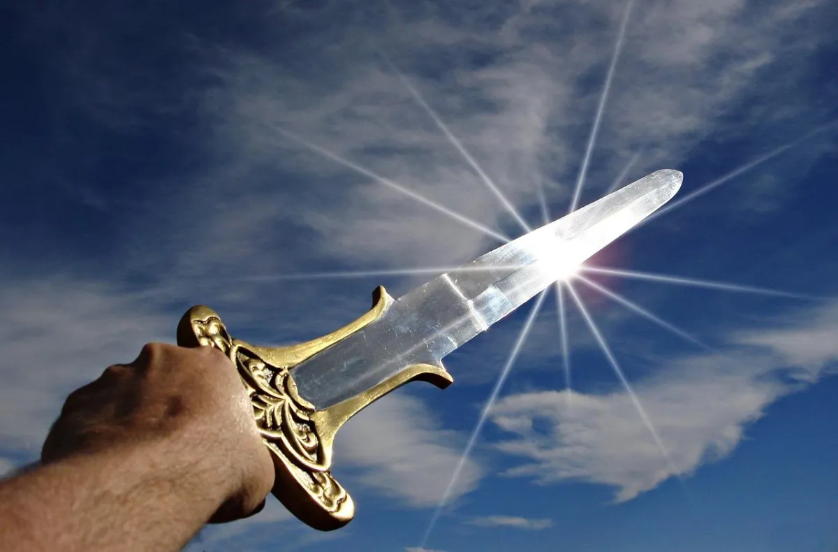 Sword "Skyfire" held aloft by the hilt, gleaming in the sunlight with tip pointed towards the heavens