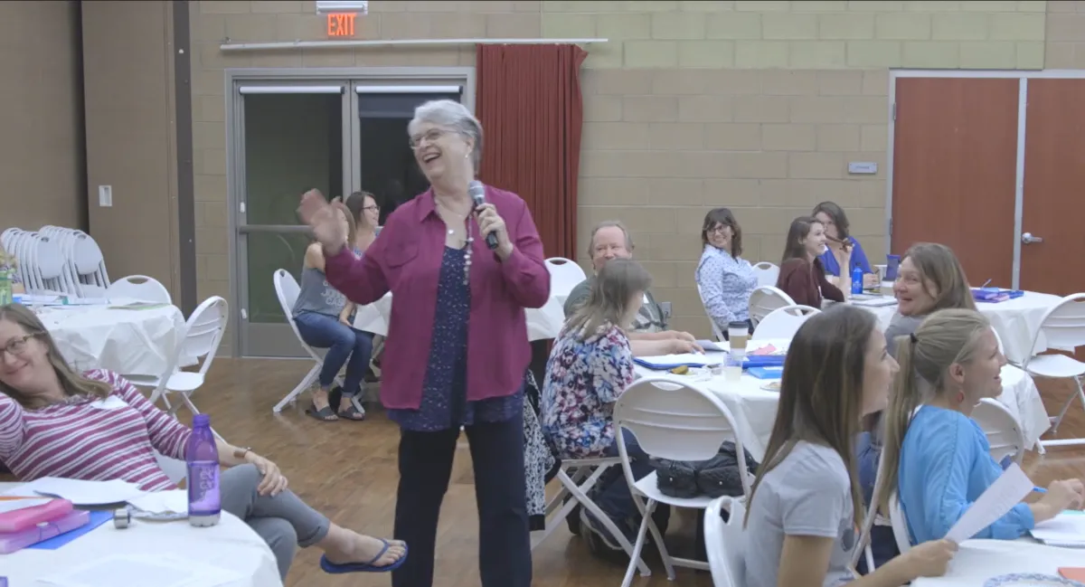 C. S. Fitzpatrick speaking in the middle of the crowd as she teaches her Crushing Dyslexia Seminar in Chandler, AZ