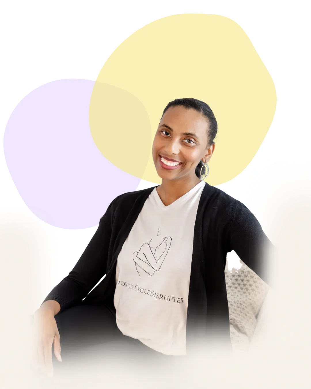 A smiling woman in a cardigan and T-shirt with hand gesture sits against a colorful abstract background.