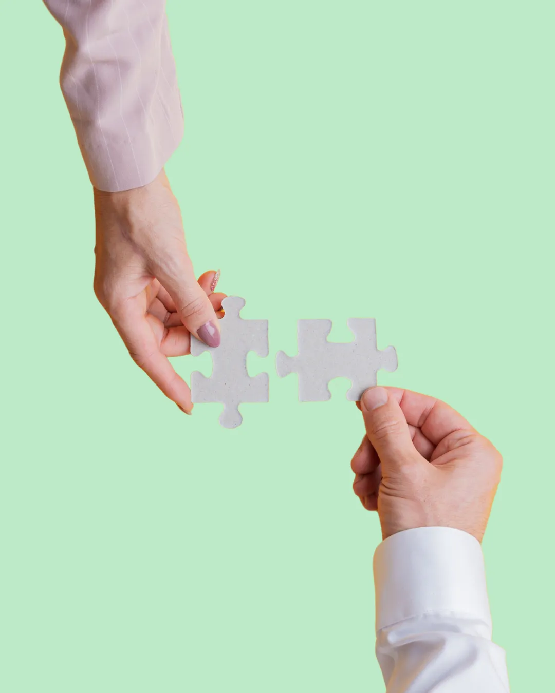 Hands holding a puzzle piece showing a relationship support message or prompt