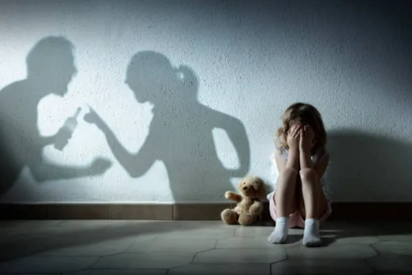 a child hiding while parents are arguing