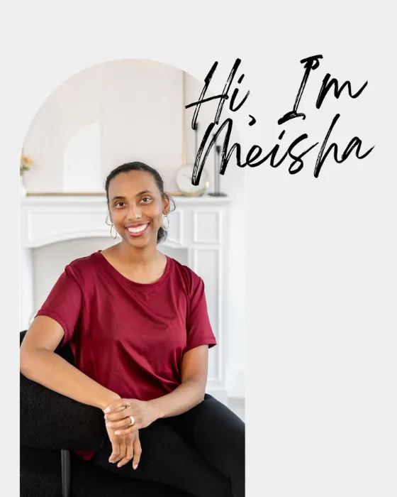 Portrait of Meisha Marshall smiling and pointing upward, founder of Renew Mindset Coaching, relationship coach for adult children of divorce