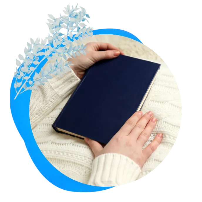image of a lady holding a blue book